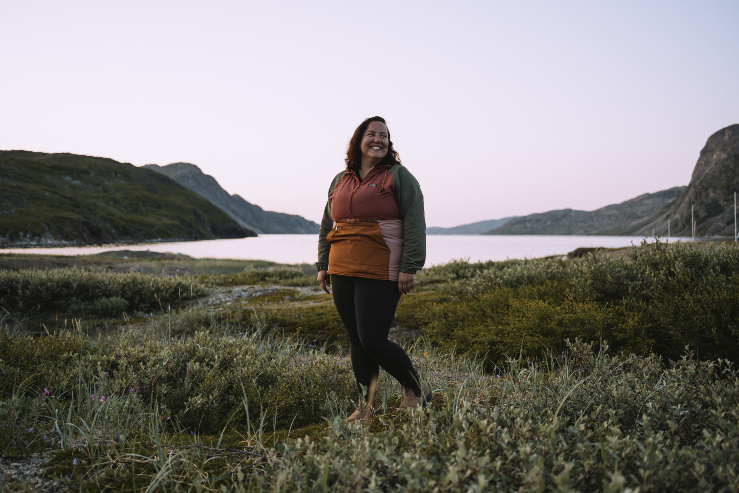 Michelle Saunders, an Inuk biologist and researcher with the Nunatsiavut government, stands near the shoreline at Basecamp, located near Torngat Mountains National Park. “I take a holistic approach to my research, which means that the land, water, animals and people are interconnected. I don’t study biology for the sake of studying biology,” she continues. “I study what is important to Nunatsiavut communities, like the health of marine life and how it is impacting our food.”